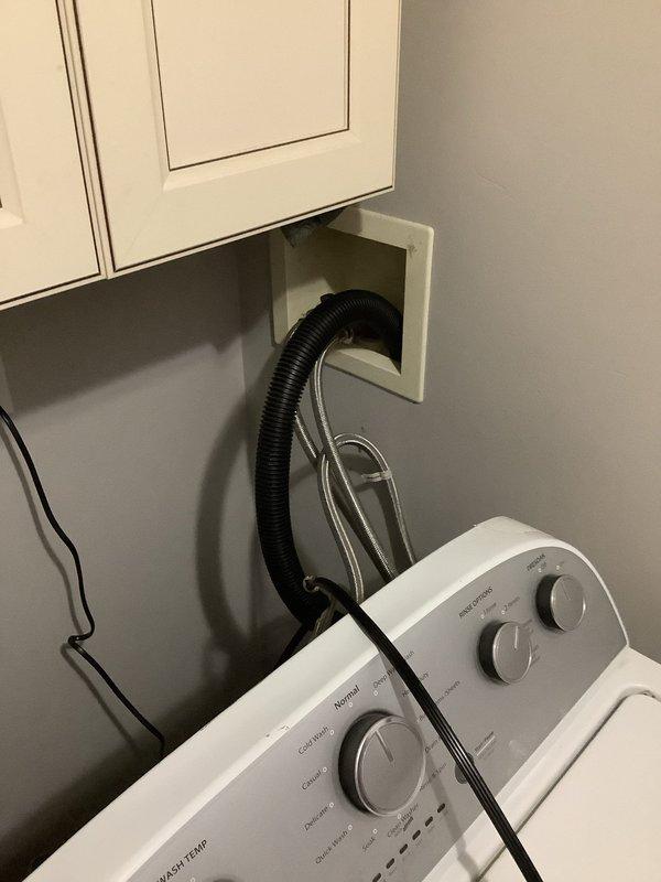 Responded to water leak service call based on customer referral. Upon inspection, identified improper washing machine drainage setup with inadequate connection to wall drain box. Confirmed no issues with main drain line; leak originated from washing machine drain hose displacement during operation. Properly secured drain hose to prevent future water spillage.