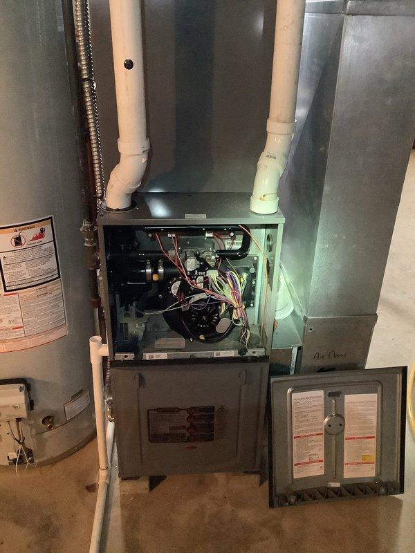 Responded to emergency call for non-operational furnace in elderly resident's home. Diagnostic inspection revealed ice blockage in the PVC exhaust vent pipe, preventing proper combustion gas ventilation. Cleared ice accumulation, inspected internal components for water damage, and verified proper operation of all safety switches. System successfully restored to normal operation with heat output confirmed. Advised customer on preventative measures to avoid future vent pipe freezing during extreme cold conditions.