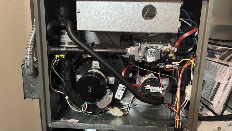 Performed comprehensive maintenance on customer's 3-year-old natural gas furnace for recurring MVP service. Inspected control board and electrical connections, ensuring all wire harnesses were properly secured and functioning. Examined blower motor assembly and fan components, verifying proper operation and cleanliness of the system.