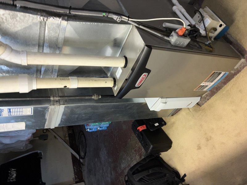 Performed comprehensive furnace tune-up, including inspection and cleaning of pleated air filter which showed moderate dust accumulation. Examined complete HVAC system including the furnace unit, PVC ventilation pipes, electrical components, and connected ductwork. Evaluated ductwork condition to assess need for cleaning service as requested.