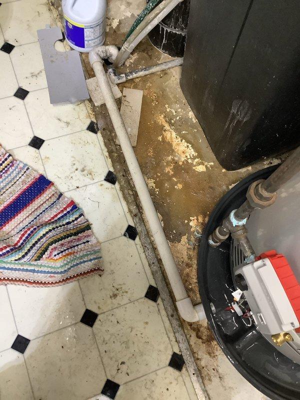 Successfully replaced water heater in basement location, requiring two technicians due to access limitations from chair lift. Installed new Bradford White unit with proper copper and galvanized vent connections, including expansion tank and necessary valve assembly. All components were properly mounted to concrete wall and tested for proper operation.
