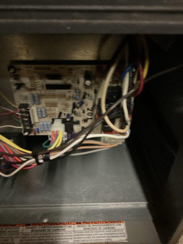 Responded to service call for furnace with operational blower but no heat output. Inspected control board and wiring connections, finding loose connections on the circuit board. Reconnected all wiring properly and verified ignition sequence. System now producing proper heat with normal operation of all components.