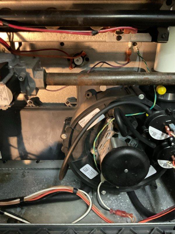 Responded to service call for furnace with operational blower but no heat output. Inspected control board and wiring connections, finding loose connections on the circuit board. Reconnected all wiring properly and verified ignition sequence. System now producing proper heat with normal operation of all components.