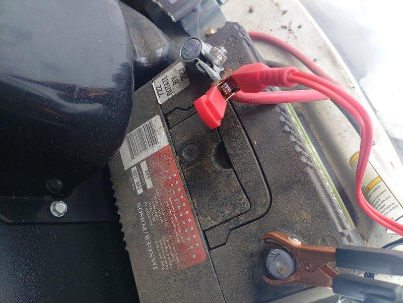 Responded to service call for generator with inactive green indicator light and illuminated warning light. Performed diagnostic testing using vehicle battery to verify electrical connectivity and control systems. Inspected exterior unit showing frost accumulation which was affecting operation. Reset system and restored normal indicator function.