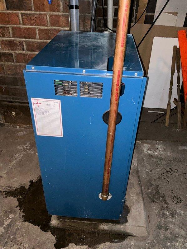 Conducted inspection of blue boiler system for customer Hershel. Internal examination revealed components including pressure gauge, copper supply lines, control board, and various valves. Observed possible moisture/small puddle near the base of the unit. Completed estimate for recommended service or replacement based on findings.