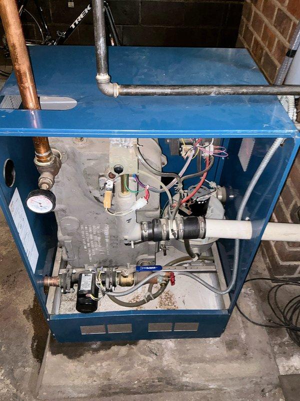 Conducted inspection of blue boiler system for customer Hershel. Internal examination revealed components including pressure gauge, copper supply lines, control board, and various valves. Observed possible moisture/small puddle near the base of the unit. Completed estimate for recommended service or replacement based on findings.