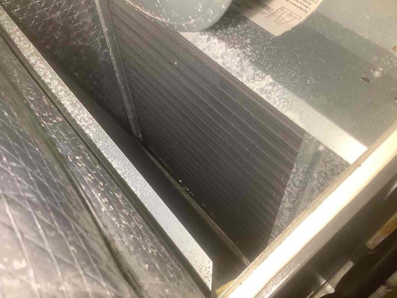 Completed furnace tune-up service on residential heating system. Inspected heat exchanger and cooling coil components for proper operation. Observed and documented condition of metal fins and internal components, noting no significant issues requiring immediate attention.