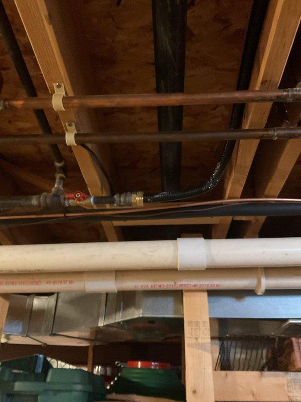 Removed old hot water tank and successfully installed new tankless water heater system, including upsizing gas line, connecting water lines to existing verticals, and installing new PVC exhaust through current vent hole. Installed condensation pump with discharge line to nearest floor drain and upgraded electrical outlet to duplex to accommodate both the new heater and pump systems.