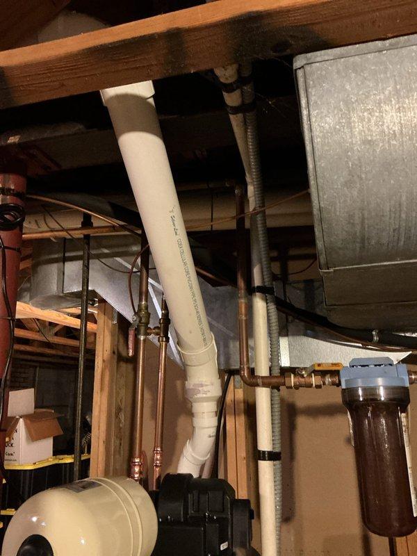 Replaced incorrect vent pipe on hot water heater that failed inspection. Installed proper code-compliant PVC vent pipe with appropriate fittings, ensuring proper ventilation for the system. Final installation now meets required inspection standards.