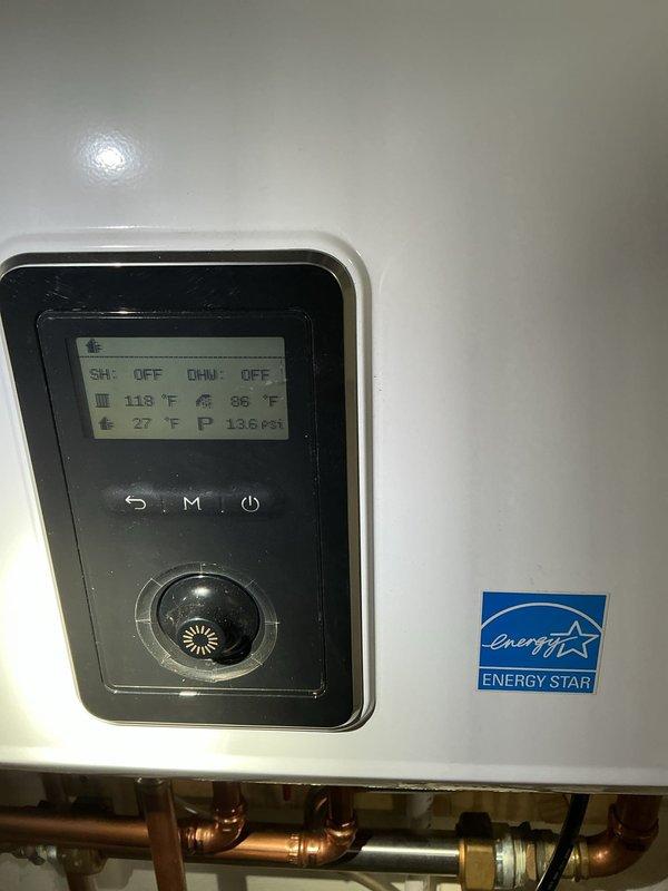Performed annual maintenance descaling service on 1-year-old Navien tankless water heater system. Thoroughly flushed unit to remove mineral buildup and scale, ensuring optimal performance and efficiency. System was verified operational with proper temperature readings (118°F, 86°F) and pressure (136 psi) after service completion.