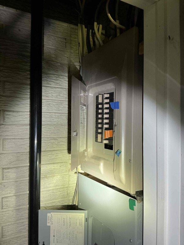 Conducted generator installation estimate at residential property with existing gas service. Inspected main electrical panel to assess available space for generator transfer switch integration. Evaluated exterior wall location with gas meter for potential generator placement, noting significant snow accumulation that will need to be addressed before installation.