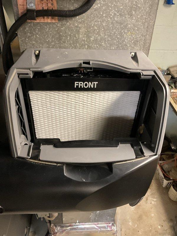 Completed scheduled heating maintenance service. Inspected system and replaced air filter, ensuring proper orientation with "FRONT" label facing correctly. Used hex key tool for access and maintenance of components as part of the MVP heating service plan.