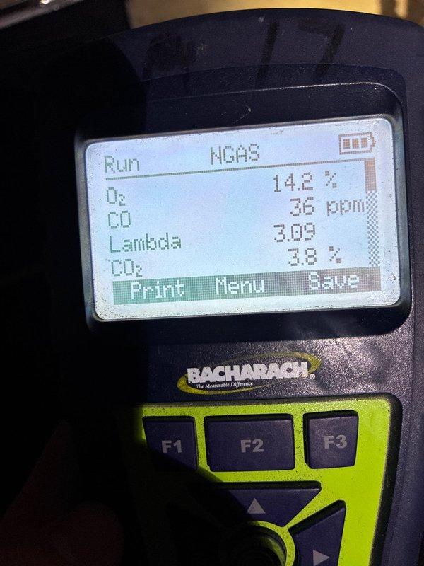 Performed heating system maintenance service which included comprehensive combustion analysis with Bacharach analyzer showing acceptable readings (O₂: 14.2%, CO: 36ppm, CO₂: 3.0%, Lambda: 3.09). Inspected control board and wiring connections, verifying proper electrical connections and harness integrity on the main circuit board.