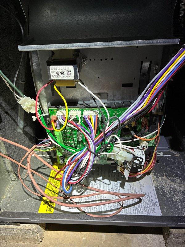 Performed heating system maintenance service which included comprehensive combustion analysis with Bacharach analyzer showing acceptable readings (O₂: 14.2%, CO: 36ppm, CO₂: 3.0%, Lambda: 3.09). Inspected control board and wiring connections, verifying proper electrical connections and harness integrity on the main circuit board.