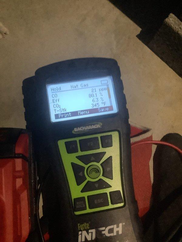 Performed scheduled heating system maintenance visit. Inspected electrical connections and wiring harness for proper installation. Conducted combustion analysis with Bacharach Fyrite INTECH analyzer, confirming natural gas readings at 21 ppm CO, 0.01% oxygen, 6.3% excess air, and combustion temperature of 385°F, all within acceptable parameters.