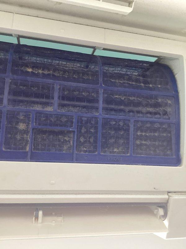 Performed scheduled maintenance on 4-year-old mini-split system. Discovered and removed severely dust-clogged filter which was significantly restricting airflow. Cleaned filter and reinstalled, restoring proper system operation and airflow.