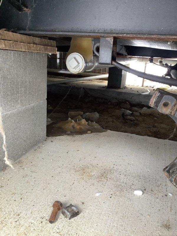 Performed inspection of sewer line under mobile home as requested by customer. Accessed crawl space to assess condition of previously repaired burst pipe. Customer had already replaced broken pipe section with pro-press fitting, but comprehensive evaluation revealed entire sewer line requires replacement. Documented current installation with photos and confirmed all areas are accessible for future service work.