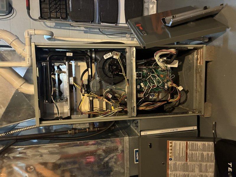 Responded to service call for 13-year-old furnace displaying efficiency error. Upon inspection of internal components, accessed control board and wiring connections to diagnose issue. After examination of blower assembly, circuit board connections, and heat exchanger, completed necessary repairs to restore proper system operation.