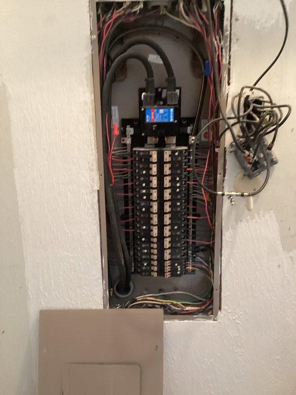 Installed dedicated circuit for mini split system in electrical panel. Removed panel cover to access interior components, connected appropriate gauge wiring to new breaker, and ensured proper termination of all conductors. Verified circuit functionality and reinstalled panel cover upon completion.
