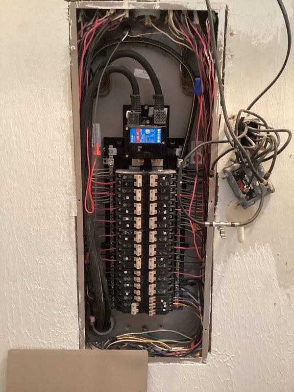 Installed dedicated circuit for mini split system in electrical panel. Removed panel cover to access interior components, connected appropriate gauge wiring to new breaker, and ensured proper termination of all conductors. Verified circuit functionality and reinstalled panel cover upon completion.
