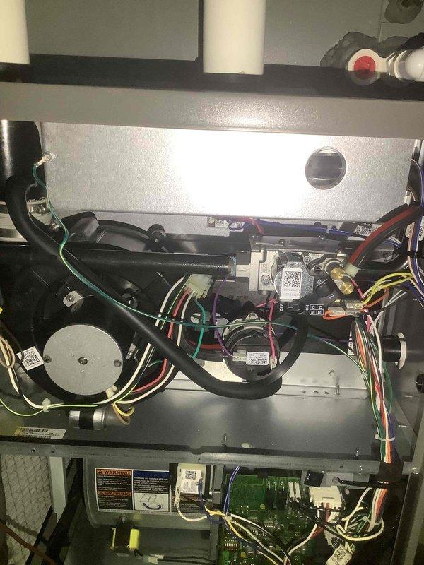Performed routine maintenance on 3-year-old furnace system. Inspected and tested electronic control boards including circuit board with ALCD ADF08S/ADF07S chips and seven-segment display. Verified proper function of all electrical components, connections, and motor assembly with no issues found.