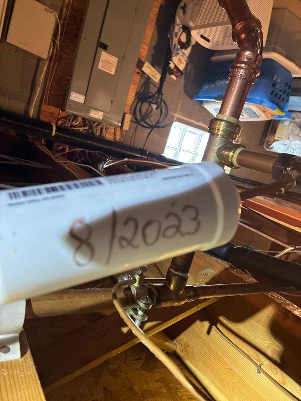 Completed annual maintenance on 1-year-old heating system (MVP Heating Visit). Inspected control board connections and flame sensor for proper operation. Checked date-stamped components (8/2023) and verified integrity of copper pipe connections and valve fittings. System functioning within normal parameters after service.