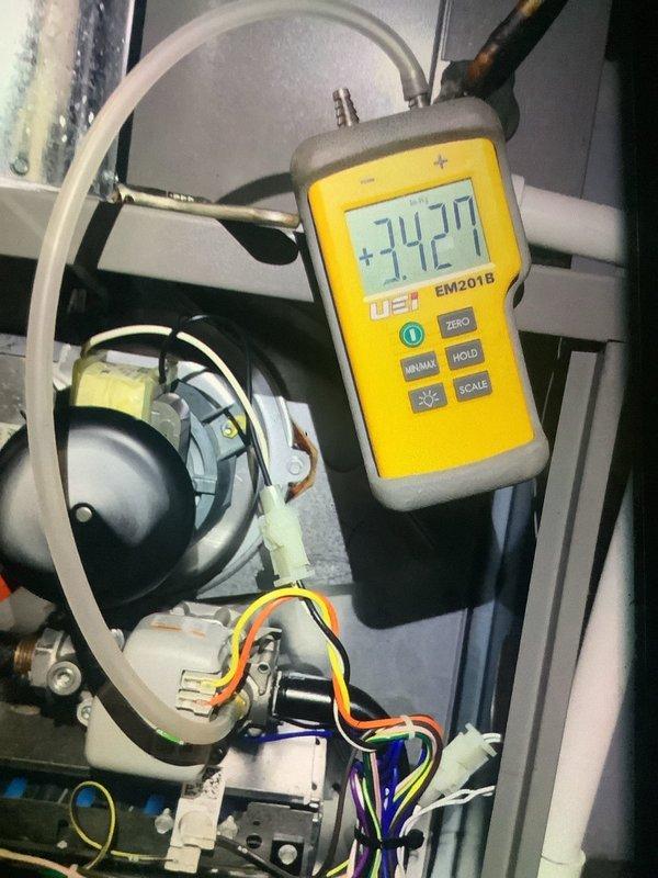 Completed scheduled heating maintenance on 3-year-old BS-MVP system. Performed diagnostic testing using UEI EM201B measurement device, obtaining temperature/pressure readings of +74.27. Inspected internal components including fan assembly, wiring harnesses, and mechanical elements. All systems functioning within normal parameters.