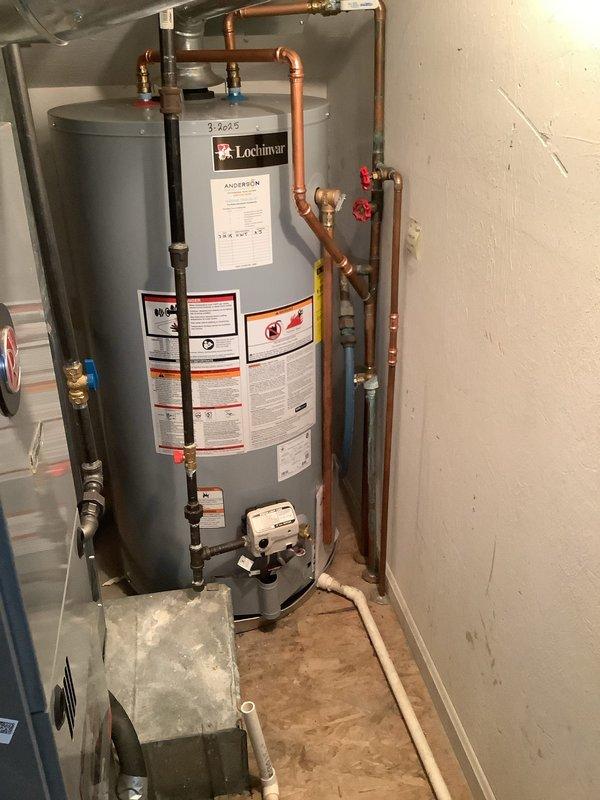 Responded to service call for frozen pipes causing complete water outage in the home. Inspected the water heater (Lochinmar model) and plumbing system in the utility area. Provided customer with professional guidance on safely thawing frozen pipes and proper procedure for restoring water service to prevent potential pipe damage and future freezing issues.