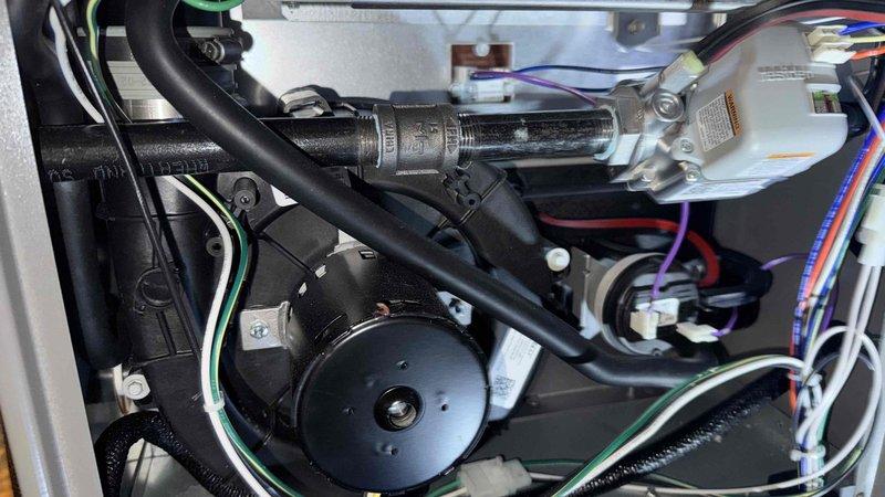 Performed scheduled furnace tune-up service. Inspected internal mechanical components including fan assembly, motor, and connection hoses - all in normal working condition. Examined control board and electrical connections; verified proper wiring integrity with no signs of damage or corrosion to electronic components.