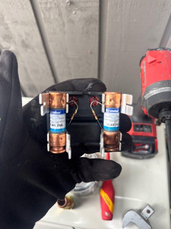 Completed installation of a single head mini split system. Installed 20A fuses for proper electrical protection and mounted the outdoor condenser unit on a pad in a narrow alcove between exterior walls. All connections were properly secured and system was tested for operation.