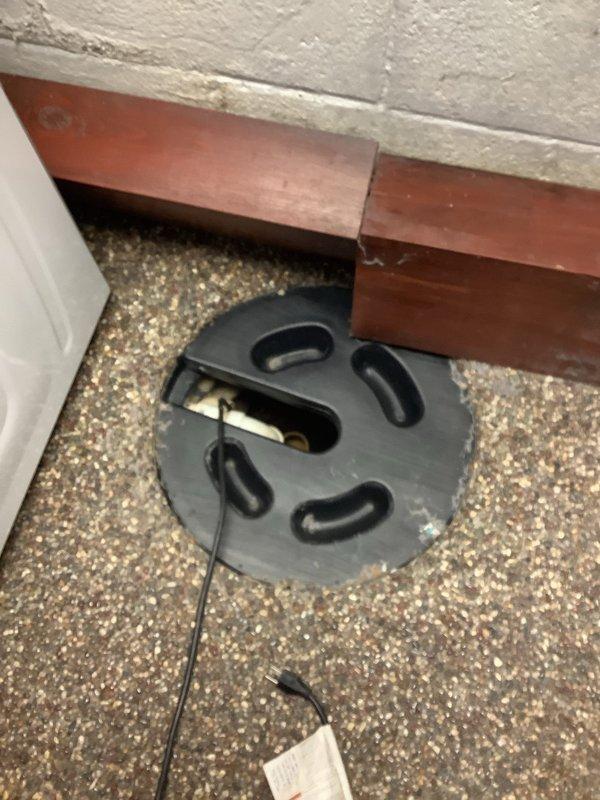 Responded to service call for non-functioning sump pump that had been spraying water, which caused electrical failure affecting both the pump and nearby dryer. Inspected sump pit, found pump submerged in murky water with visible float switch malfunction. Replaced damaged sump pump system, ensuring proper installation of discharge pipe and electrical connections. Verified system operation before completion. Customer advised that electrician was scheduled to address related electrical issues.