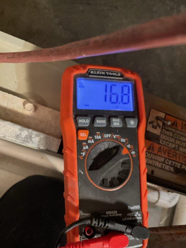 Performed routine maintenance on 17-year-old gas furnace with MVP (Multipoise Variable Performance) system. Tested electrical components with multimeter confirming proper voltage readings at 16.8V. Inspected gas line connections and brass fittings, noting some oxidation but confirming all connections remain secure and functional.