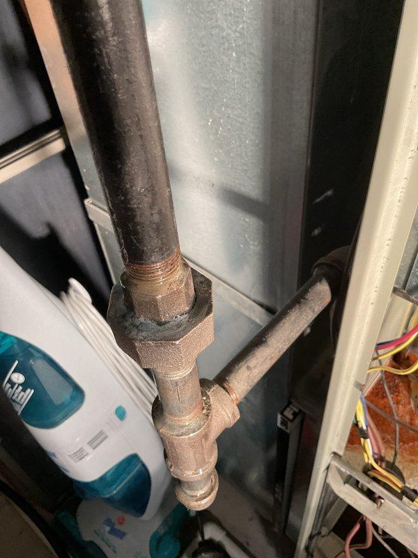 Performed routine maintenance on 17-year-old gas furnace with MVP (Multipoise Variable Performance) system. Tested electrical components with multimeter confirming proper voltage readings at 16.8V. Inspected gas line connections and brass fittings, noting some oxidation but confirming all connections remain secure and functional.