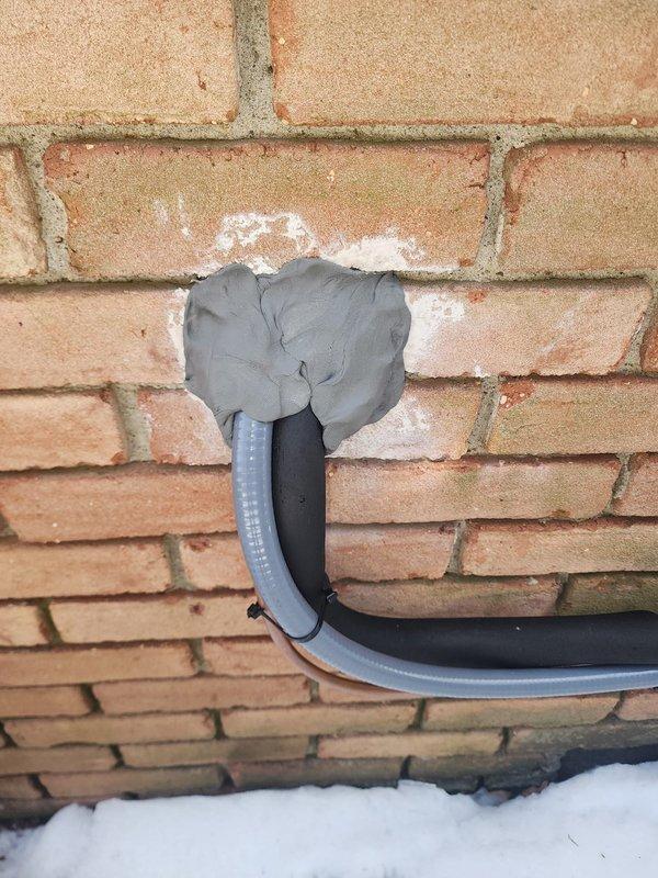 Responded to failed inspection callback regarding missing thumb gum and locking caps. Installed required locking caps on service valves and applied appropriate thumb gum sealant at the line set penetration through exterior brick wall to ensure proper sealing and code compliance.