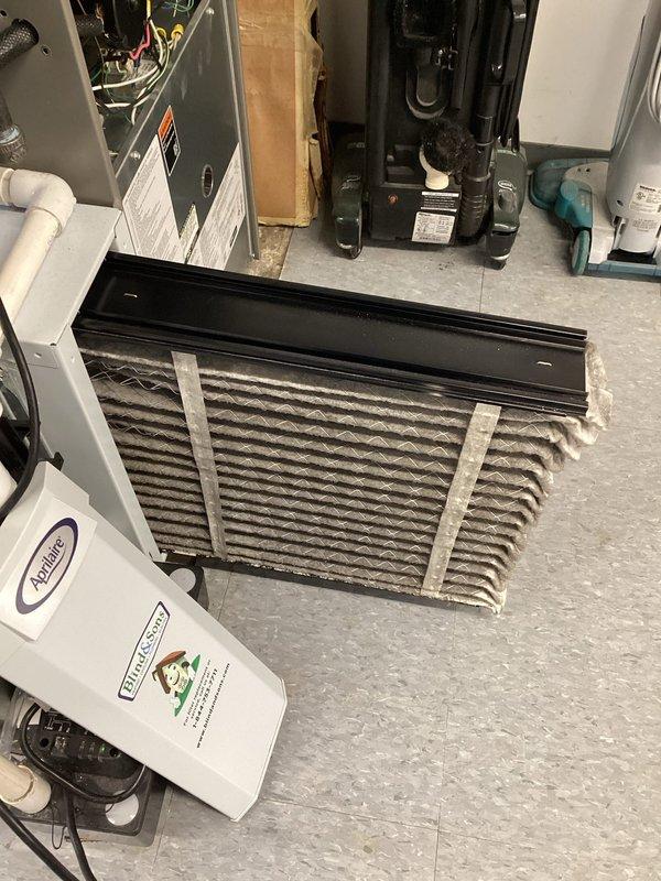 Performed scheduled MVP Heating maintenance service, which included inspection of the furnace system and associated components. Replaced dirty pleated air filters with new Naturalaire filters. Examined and cleaned the humidifier unit, checking the honeycomb evaporator pad and water supply connections for proper function.
