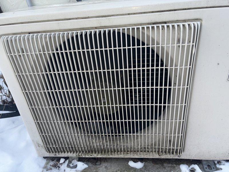 Performed routine maintenance on customer's mini-split system. Cleaned heavily soiled air filter that showed significant dust and debris accumulation. Inspected outdoor condenser unit which displayed dirt buildup and mildew formation along lower edge of protective grill; cleaned unit exterior to ensure proper airflow and system efficiency.