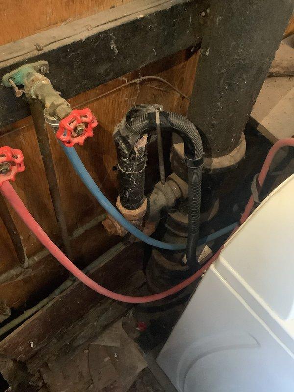 Completed P-trap replacement on tub/shower drain system in 75-year-old residential home. Inspection revealed aged plumbing connections with signs of mineral buildup and corrosion at pipe joints. Accessed underfloor area to complete the replacement, ensuring proper drainage and connection to the main waste line.
