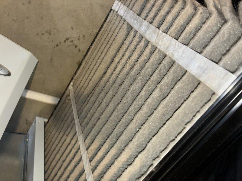 Performed scheduled heating maintenance visit. Discovered heavily clogged air filter with significant dust and debris accumulation. Inspected blower motor assembly and electrical connections, noting proper wire routing and component condition.