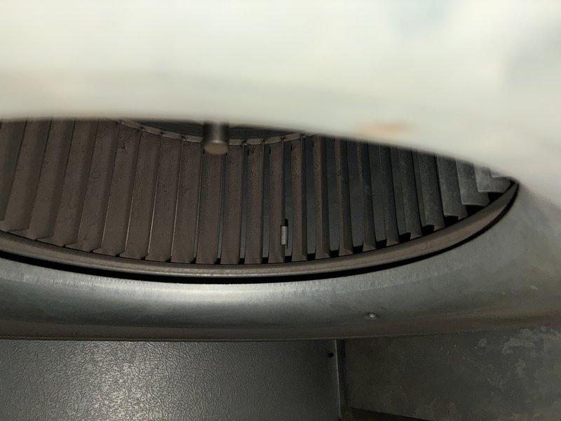 Performed routine maintenance on 8-10 year old furnace. Inspected blower wheel and fan assembly which were found to be in functional condition. System is operating within normal parameters.