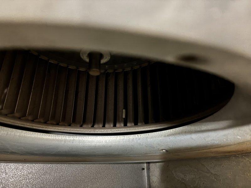 Performed routine maintenance on 8-10 year old furnace. Inspected blower wheel and fan assembly which were found to be in functional condition. System is operating within normal parameters.