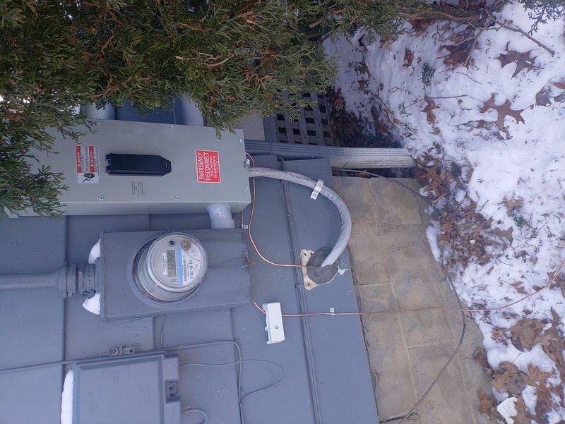 Completed installation of a 150 amp electrical panel with 30 spaces, including AC circuit with proper grounding rod. Service equipment was mounted on exterior wall with meter installed below the panel. Work was performed during winter conditions with all components properly secured and connected.