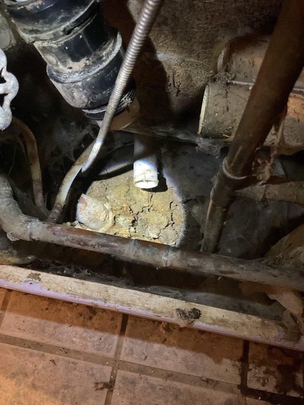 Responded to emergency service call for broken pipe near shower in 78-year-old home built on slab. Upon inspection, found severely corroded supply pipe that had rotted through and detached, causing water leakage. Replaced damaged section with new copper piping, restored water flow, and verified proper operation with no leaks.