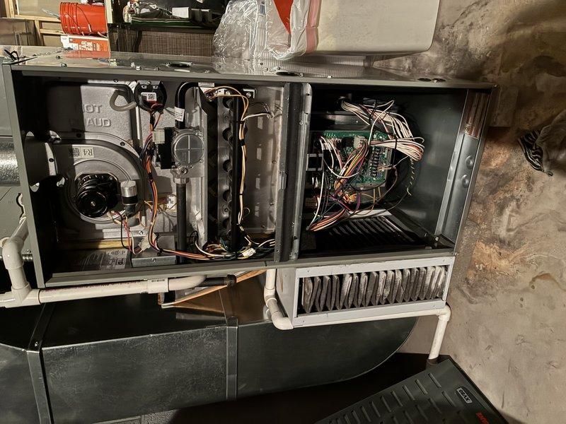 Performed routine maintenance on 9-year-old furnace. Inspected blower wheel assembly for proper operation and cleaned components. Examined internal wiring connections and circuit board functionality with no issues detected.