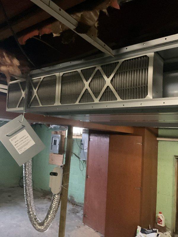 Completed mini split maintenance service by replacing all filters in the system located in the utility room. Removed old pleated filters with metal framing and installed new filters with proper diamond pattern arrangement. System now operating with improved airflow and filtration capacity.