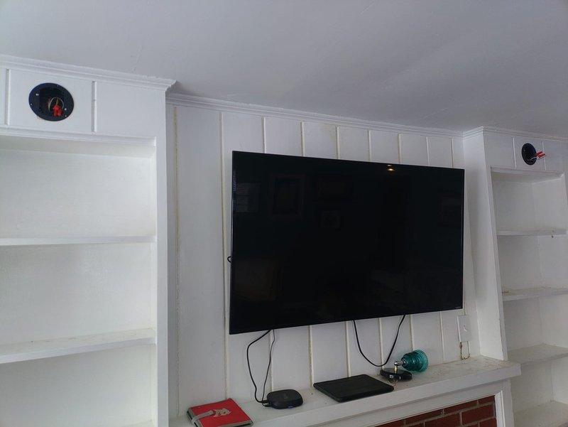 Installed two new sconce lights on either side of wall-mounted television with dimmer control. Additionally, completed installation of a new electrical outlet in dining room area as requested. All components were properly delivered and installed according to specifications.