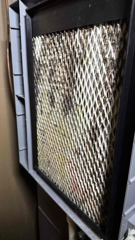Responded to service call for furnace shutdown issues. Found air filter heavily clogged with dust and debris, restricting proper airflow. Replaced filter and inspected PVC exhaust vent, confirming proper installation and ventilation with no obstructions.