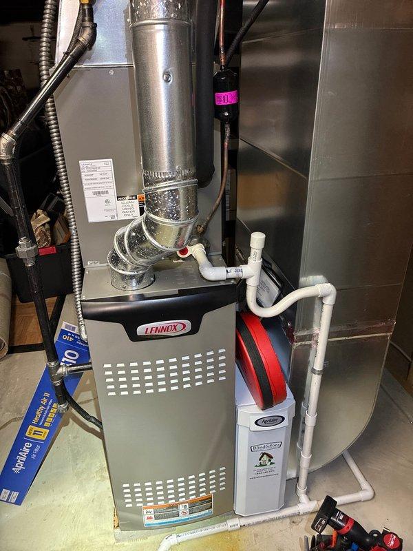 Performed routine tune-up on 1.5-year-old Lennox furnace system. Inspected all components including ductwork, condensate drainage, and connected air purifier/humidifier unit. Used hex key to make necessary adjustments to ensure optimal system performance and efficiency.