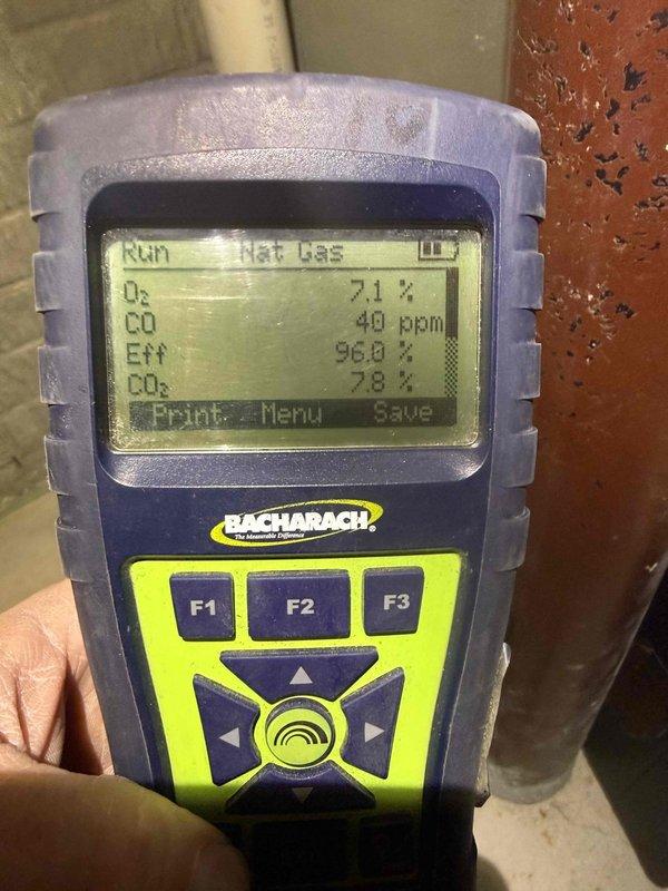 Performed scheduled heating system maintenance service including combustion analysis testing on natural gas system showing optimal efficiency of 96.0% with acceptable O₂ (7.1%), CO₂ (7.8%), and CO (40 ppm) levels. Inspected and verified proper operation of blower motor assembly, circuit board connections, and wiring harness integrity with all components found in good working condition.