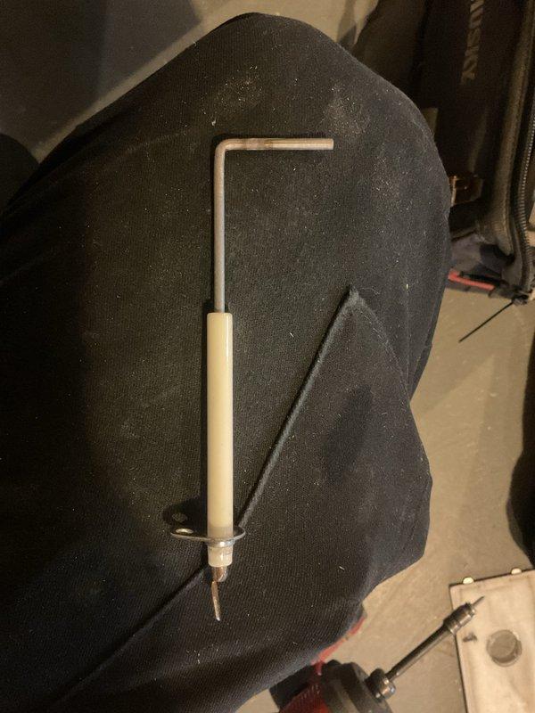 Conducted annual MVP Heating maintenance service in basement utility area. Inspected water heater system, checking pilot lights and gas line connections. Utilized hex tool for minor adjustments to ensure optimal heating system performance.