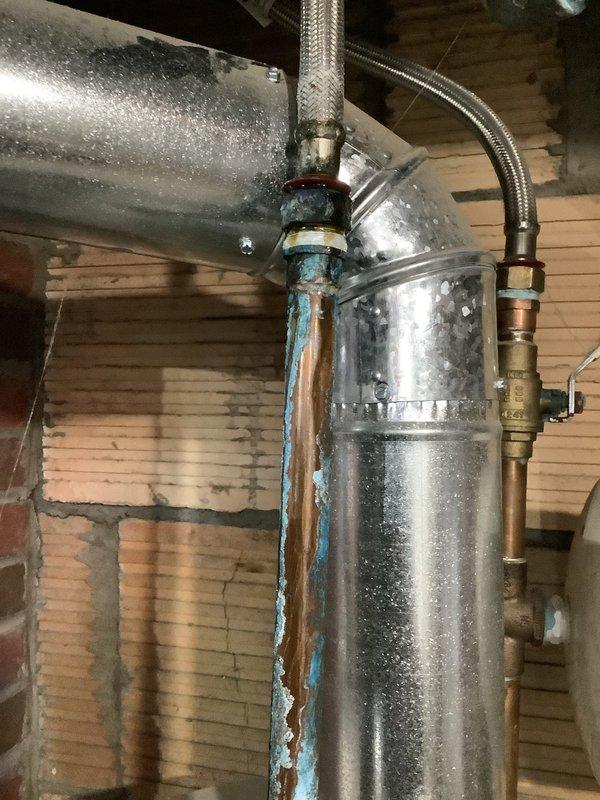 Responded to service call for water leak at customer's residence. Identified and repaired corroded copper pipe above 6-year-old hot water heater that showed significant oxidation and blue-green patina indicating an ongoing moisture issue. Verified proper function of all plumbing connections and ensured no further leakage from the repaired area.